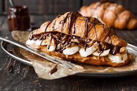 fruit-filled croissant drizzled with chocolate